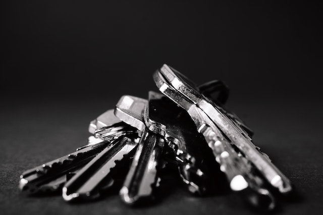 A bunch of keys on a black background.
