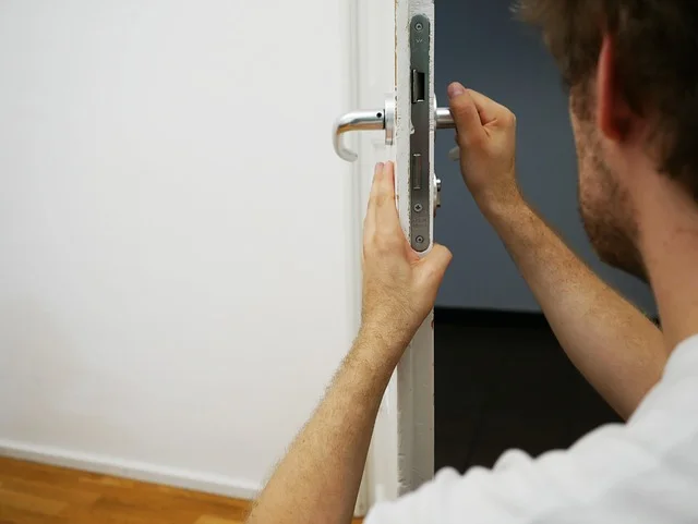 An expert locksmith doing checking a door lock properly.