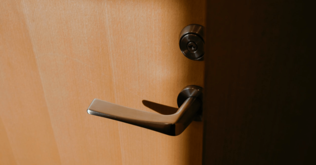 Close-up photo of a door lock and door handle.