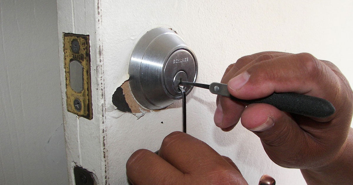 Man PIcking a Door Lock